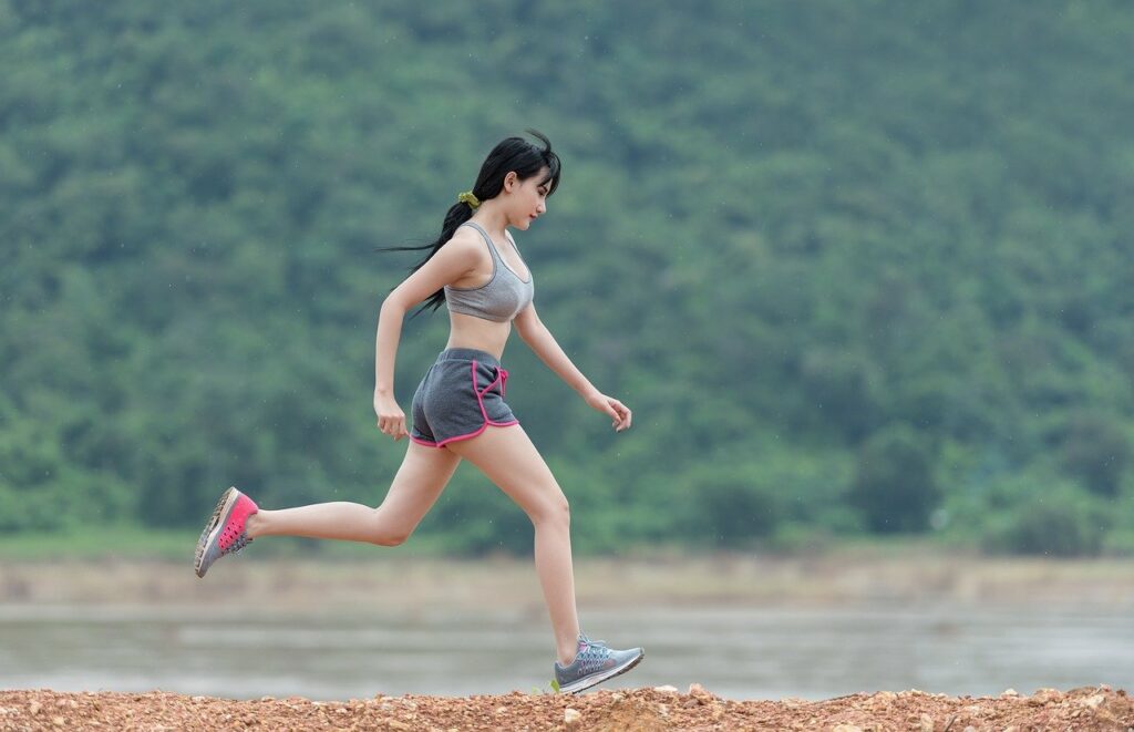woman running on dirt road